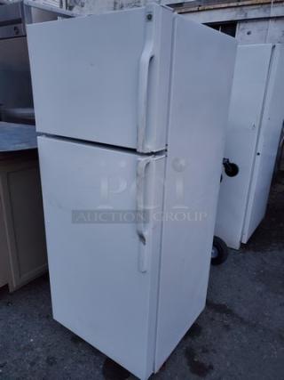 GE Top-Freezer Refrigerator. Unknown condition in regards to the top (Freezer) section. Sold as is.