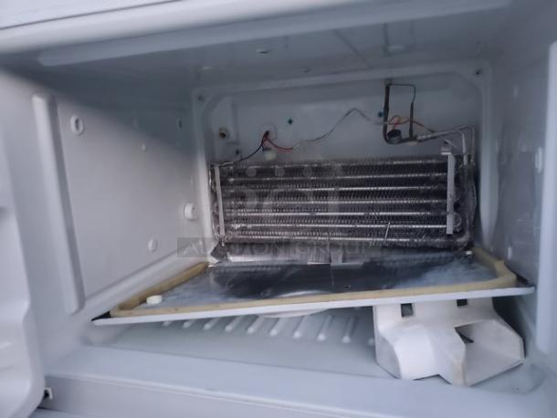 GE Top-Freezer Refrigerator. Unknown condition in regards to the top (Freezer) section. Sold as is. - Image 2 of 5