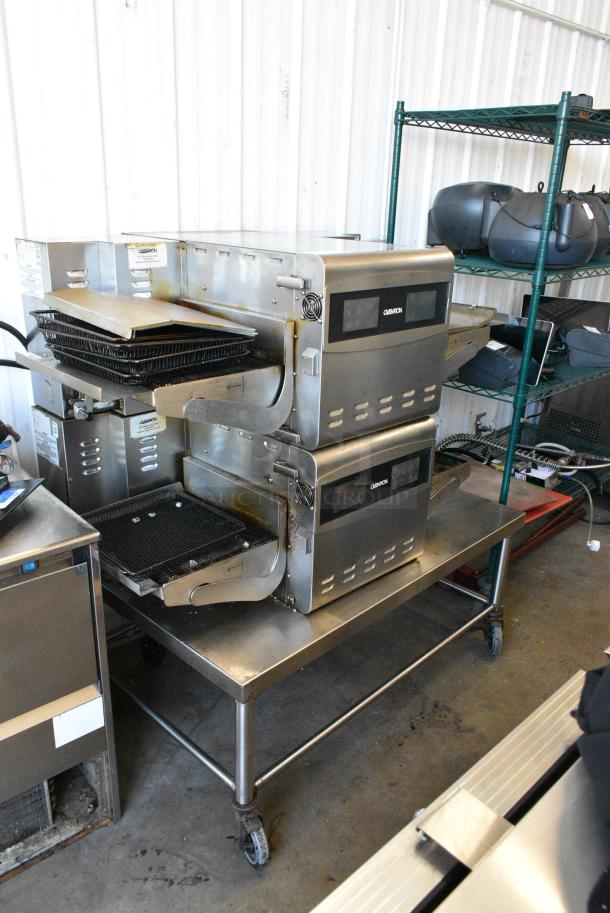 2 Ovention S1200 Stainless Steel Commercial Electric Powered Conveyor Rapid Cook Ovens on Stainless Steel Commercial Equipment Stand w/ Commercial Casters. 208/240 Volts, 1 Phase. 2 Times Your Bid! - Image 1 of 11