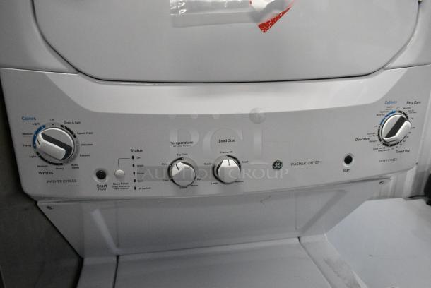 BRAND NEW SCRATCH AND DENT! General Electric GE GUD27GSSMWW Metal Stacked Washer and Dryer. - Image 2 of 5