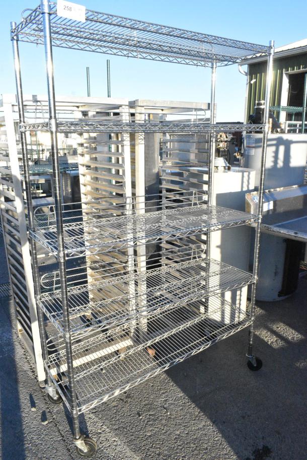 Chrome Finish 5 Tier Wire Shelving Unit on Commercial Casters. BUYER MUST DISMANTLE. PCI CANNOT DISMANTLE FOR SHIPPING. PLEASE CONSIDER FREIGHT CHARGES. - Image 1 of 4