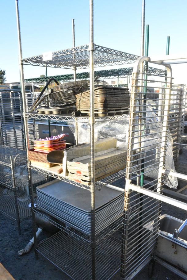 Chrome Finish 5 Tier Wire Shelving Unit w/ Contents Including Metal Baking Pans. BUYER MUST DISMANTLE. PCI CANNOT DISMANTLE FOR SHIPPING. PLEASE CONSIDER FREIGHT CHARGES. - Image 1 of 1