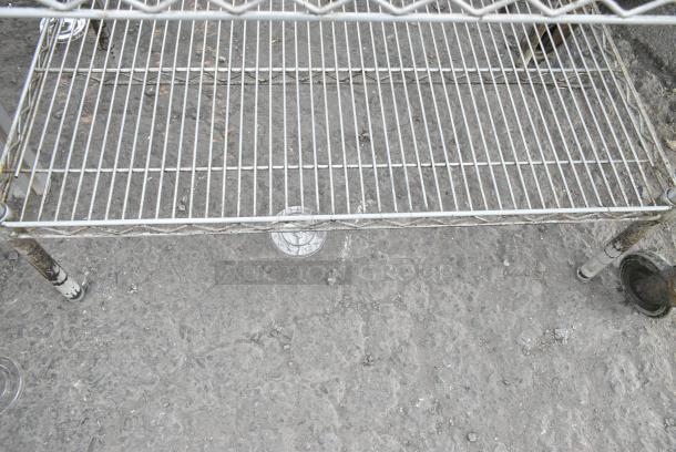 Chrome Finish 2 Tier Wire Shelving Unit. BUYER MUST DISMANTLE. PCI CANNOT DISMANTLE FOR SHIPPING. PLEASE CONSIDER FREIGHT CHARGES. - Image 2 of 2