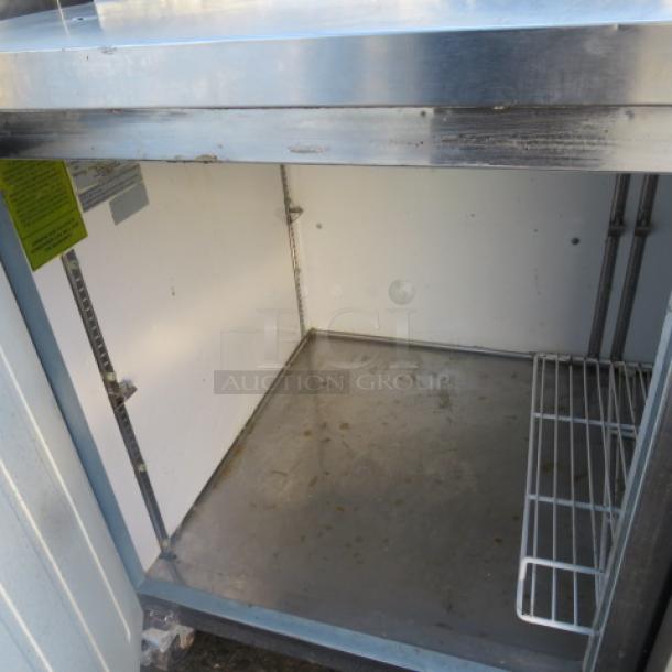 One Servware 2 Door Refrigerated Prep Table With 2 Racks, On Casters. 115 Volt. Model# PP67-9. 71X32X40. $4118.40. - Image 2 of 2