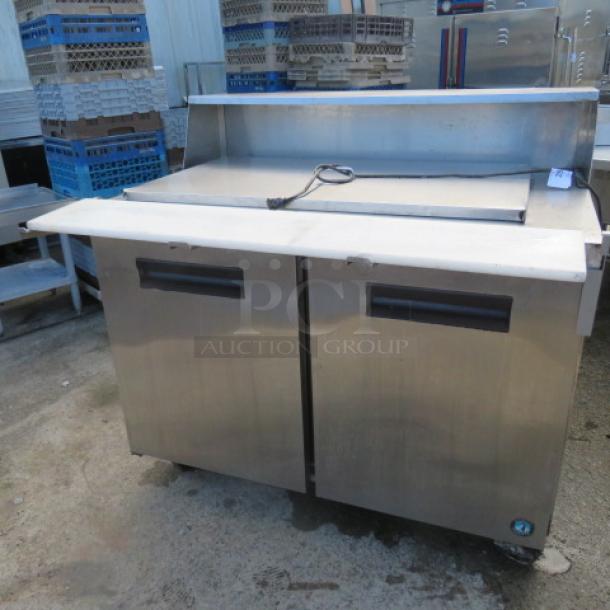 One Hoshizaki 2 Door Refrigerated Prep Table With 2 Racks On Casters. Model# CRMR48-18M. 115 Volt. 48X38X45. $4860.00. - Image 1 of 3