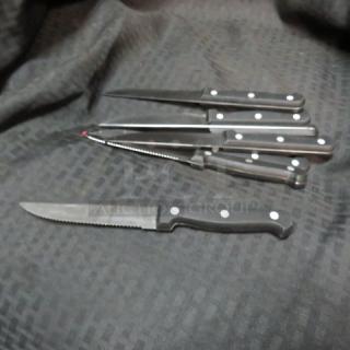 One Lot Of 7 Steak Knives.