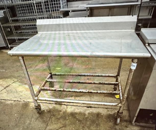 One Stainless Steel Table With Back Splash On Casters. 48X30X39.5 - Image 1 of 1