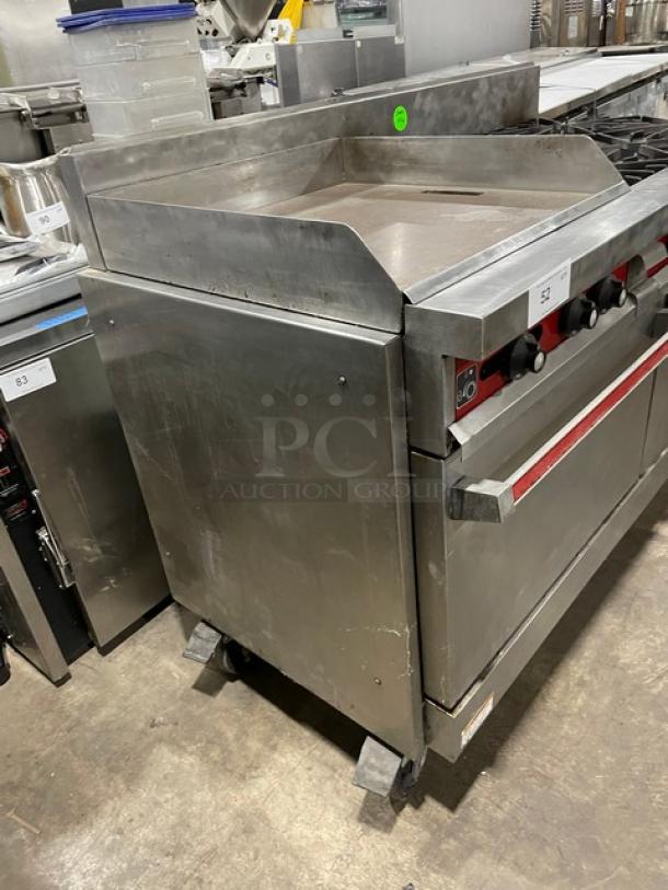 Vulcan Commercial Natural Gas Powered 6 Burner Range Split Top With Flat Griddle! With 2 Full Sized Ovens Underneath! All Stainless Steel! With Metal Oven Racks! On Casters! Working When Removed! - Image 3 of 11