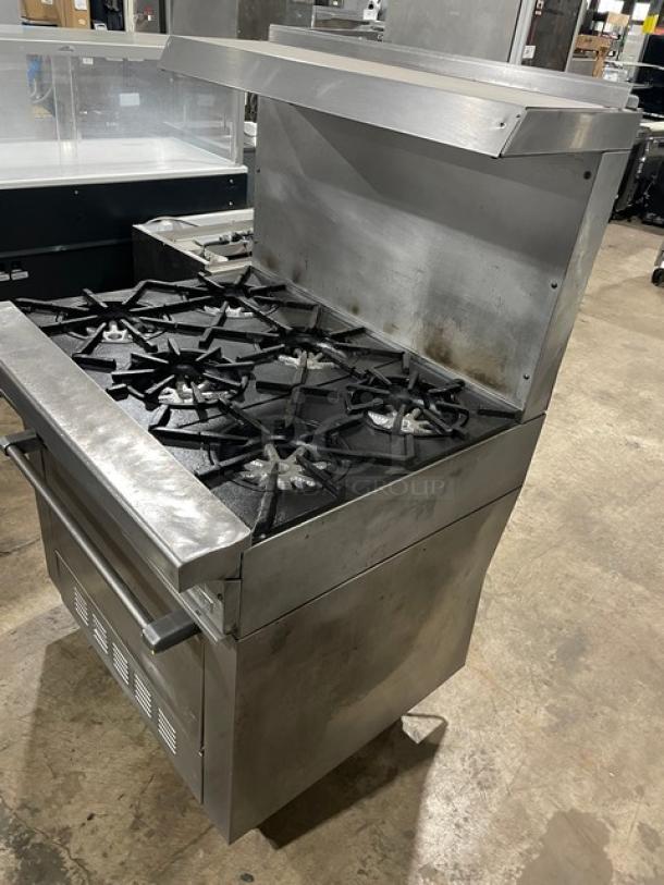 Garland Commercial Natural Gas Powered 6 Burner Range! With Full Sized Oven Underneath! With Back Splash & Overhead Salamander Shelf! All Stainless Steel! On Legs! - Image 2 of 9