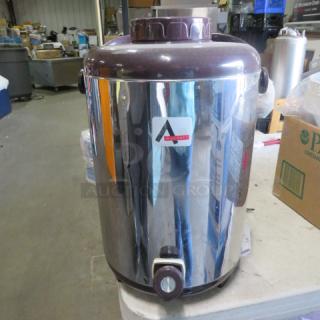 One Adcraft Beverage Dispenser.