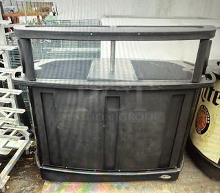 One IRP Poly  Kiosk  With Serving Shelf, On Casters. 60.5X30X49