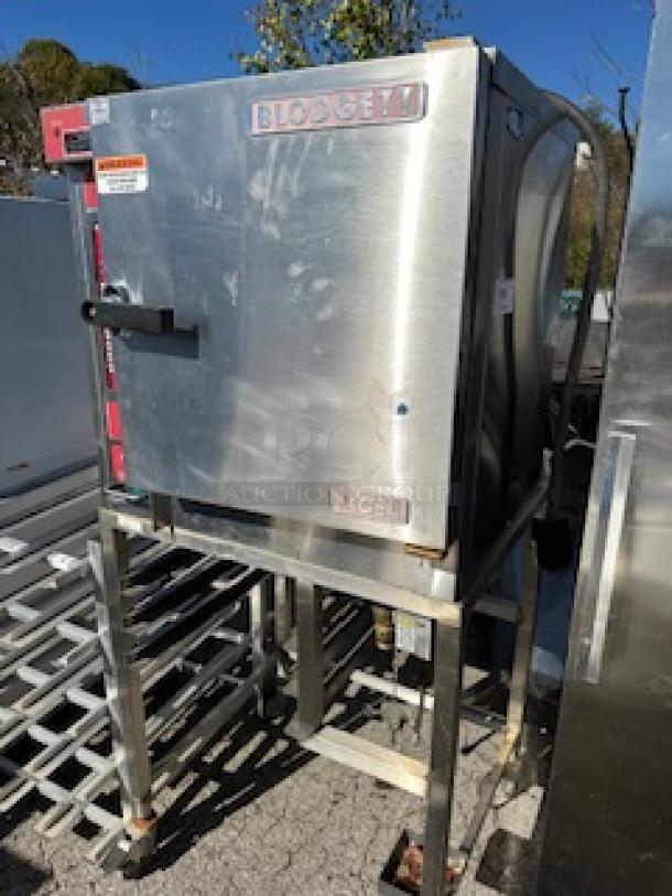 One Blodgett XCEL Electric Convection Oven, With 2 Racks, On A Stand With Casters.  208-240 Volt. 3 Phase.  Model# XL50EC. 32X27X69 - Image 1 of 2