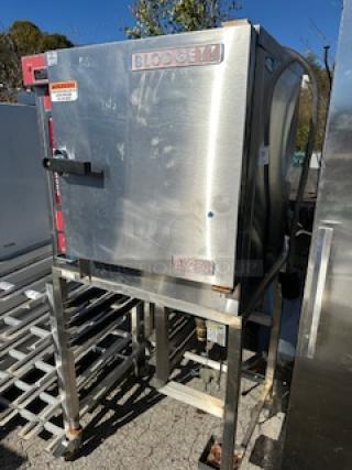 One Blodgett XCEL Electric Convection Oven, With 2 Racks, On A Stand With Casters.  208-240 Volt. 3 Phase.  Model# XL50EC. 32X27X69