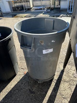 One Huskee 32 Gallon Trash Can On A Dolly.