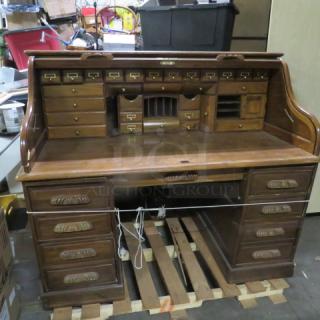 On  e Solid Oak Roll Top Desk With Multiple Drawers. Small Crack See Pics. 61X36X51