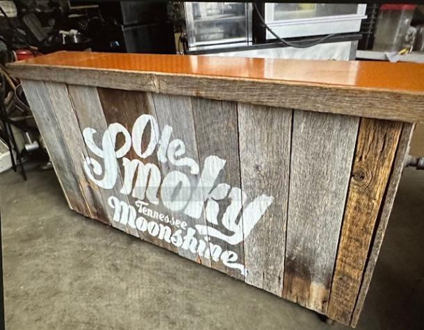 One Wooden OLE SMOKEY Kiosk With 2 Door, 1 Shelf Under Storage , And A Laminate Top On Casters. 75.X27X40 - Image 1 of 4