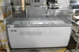 BRAND NEW SCRATCH AND DENT! Avantco 360ADC12HC Metal Commercial Ice Cream Dipping Cabinet w/ Sneeze Guard, Tub Collars and Baskets on Commercial Casters. 115 Volts, 1 Phase. Tested and Working!