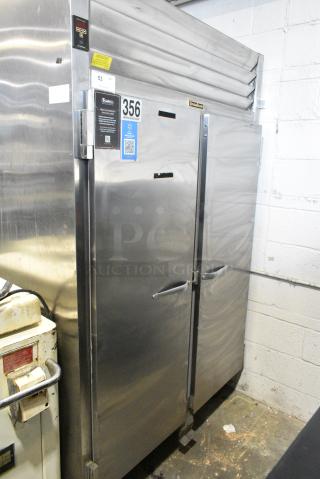 Traulsen RE232N-ZCF02 Stainless Steel Commercial 2 Door Reach In Cooler on Commercial Casters. 115 Volts, 1 Phase. Tested and Does Not Power On