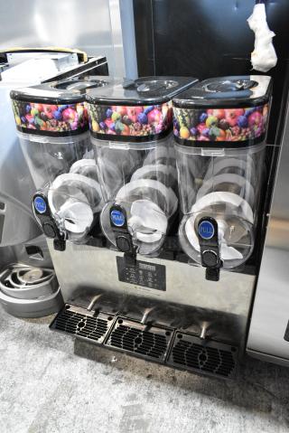 BRAND NEW SCRATCH AND DENT! XN360A Stainless Steel Commercial Countertop 3 Hopper Slushie Machine. 110 Volts, 1 Phase. Tested and Powers On But Parts Do Not Move
