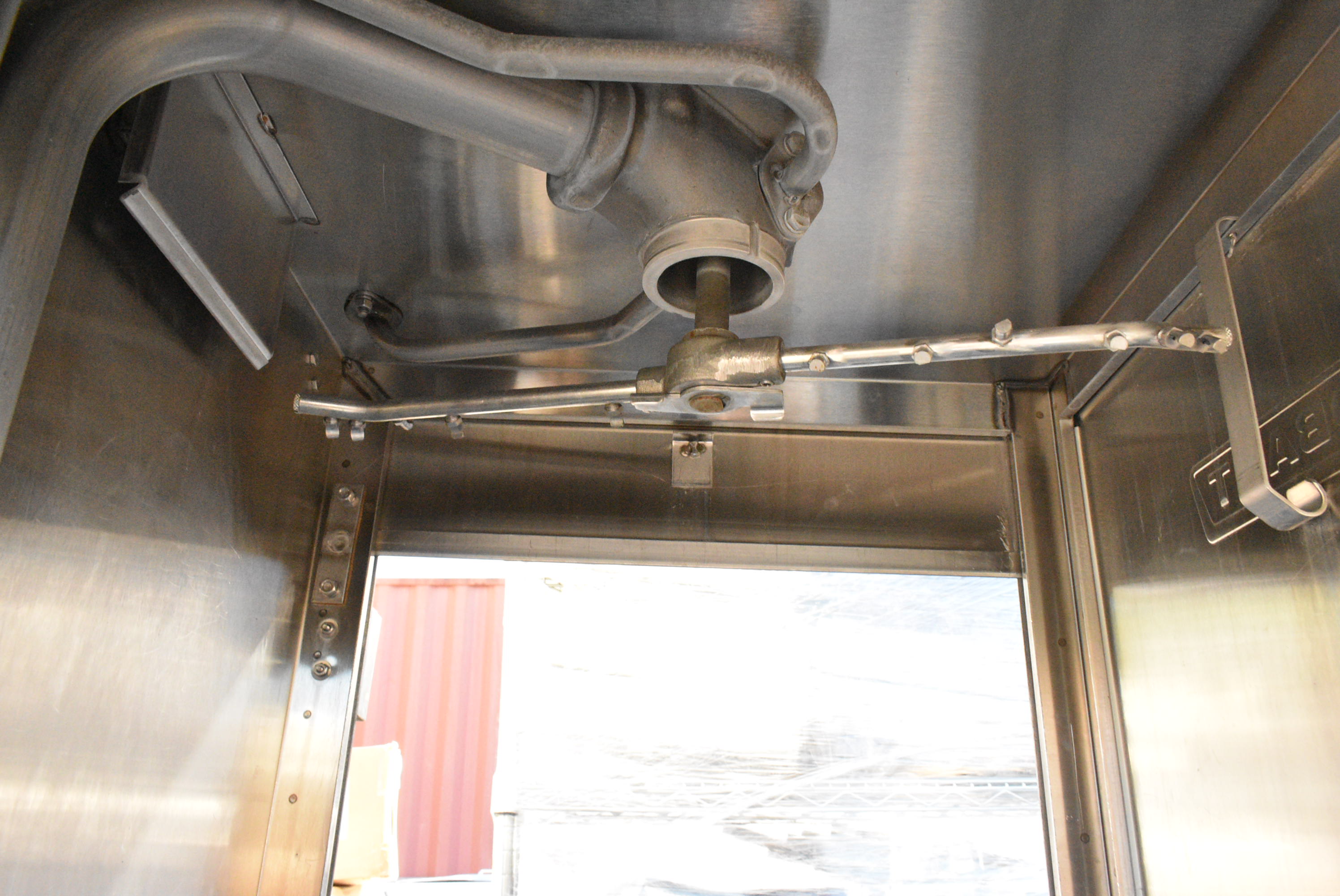 Upper spray arm for pass-through dishwasher showing jet configuration