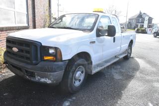 2006 Ford F250 Super Duty 2WD Pick Up Truck w/ Crew Cab, Headache Guard and Tommy Gate PUW60-1340S38TP4 liftgate. VIN 1FTSX20566ED68092. Title In Hand. Needs a Timing Chain. Vehicle Runs and Drives But Needs a New Battery; Will Need To Be Jump Started.