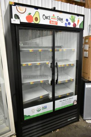 2019 True TVM-48SL-HC Metal Commercial 2 Door Reach In Cooler Merchandiser w/ Poly Coated Racks. 115 Volts, 1 Phase. Tested and Working!