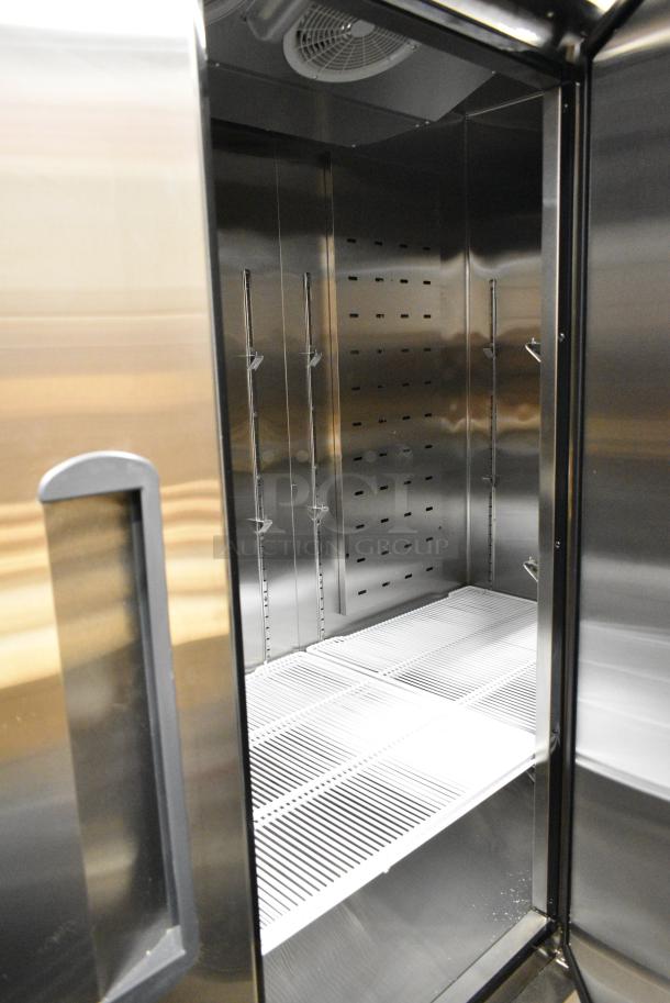 BRAND NEW SCRATCH AND DENT! 2022 Migali C-3FB-HC Stainless Steel Commercial 3 Door Reach In Freezer w/ Poly Coated Racks on Commercial Casters. 115/208-230 Volts, 1 Phase. - Image 7 of 9