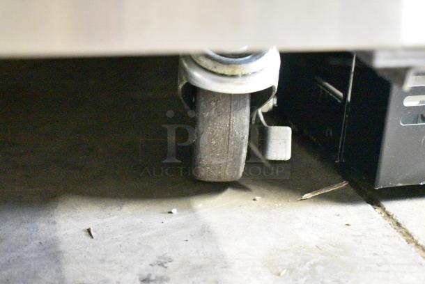 BRAND NEW SCRATCH AND DENT! 2019 Migali C-U72R-HC Stainless Steel Commercial 3 Door Undercounter Cooler on Commercial Casters. 115 Volts, 1 Phase. Tested and Working! - Image 6 of 10