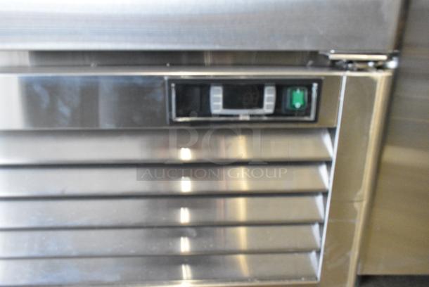 BRAND NEW SCRATCH AND DENT! 2018 Migali C-1FB-HC Stainless Steel Commercial Single Door Reach In Freezer w/ Poly Coated Racks on Commercial Casters. 115 Volts, 1 Phase. Tested and Powers On But Does Not Get Cold - Image 6 of 8