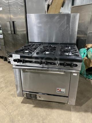 Southbend Commercial Stainless Steel Natural Gas Powered 6 Burner Range! With Full Sized Oven Underneath! With Back Splash! With Wire Oven Racks! Model: 300F SN: 93H73969! On Legs!