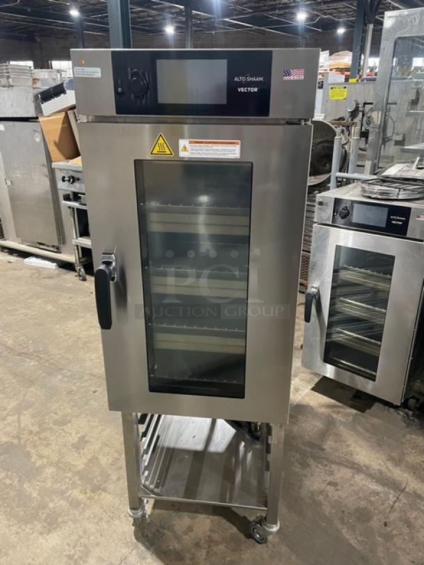 LATE MODEL! 2020! Alto Shaam Commercial Electric Powered Half Size Multi-Cook Oven! With 4 Cooking Chamber Zones! With Individual Controls! On Storage Shelf With 5 Pan Holding Rack! All Stainless Steel! With Metal Oven Racks! On Casters! 208-240V 3 Phase! Model: VMC-H4H SN: 2694173-000! Working When Removed! - Image 1 of 9