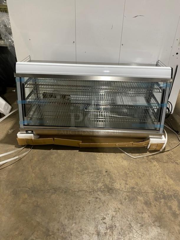 New! Scratch-N-Dent! Marchia Commercial Stainless Steel 48" Heated Countertop Display/Showcase! With Front & Rear Sliding Glass Doors! With LED Lighting! With Adjustable Chrome Plated Wire Racks! With Thermostatic Temperature Control! Model: SHCC186! 110-120V! On Legs! - Image 1 of 13