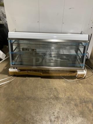 New! Scratch-N-Dent! Marchia Commercial Stainless Steel 48" Heated Countertop Display/Showcase! With Front & Rear Sliding Glass Doors! With LED Lighting! With Adjustable Chrome Plated Wire Racks! With Thermostatic Temperature Control! Model: SHCC186! 110-120V! On Legs!