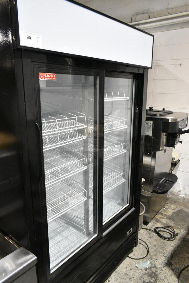 JDM-40SD Metal Commercial 2 Door Reach In Cooler Merchandiser w/ Poly Coated Racks on Commercial Casters. 115 Volts, 1 Phase. Tested and Powers On But Does Not Get Cold - Image 1 of 5
