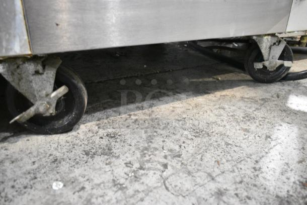 Traulsen G10000 Stainless Steel Commercial 2 Half Size Door Reach In Cooler w/ Poly Coated Racks on Commercial Casters. 115 Volts, 1 Phase. Tested and Powers On But Does Not Get Cold - Image 5 of 6