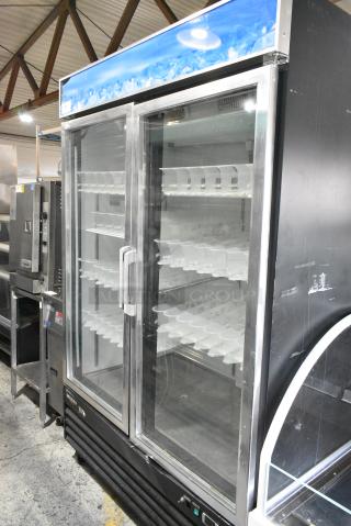 Avantco G1.2BM2F-HC Metal Commercial 2 Door Reach In Cooler Merchandiser w/ Poly Coated Racks on Commercial Casters. 115 Volts, 1 Phase. Tested and Working!