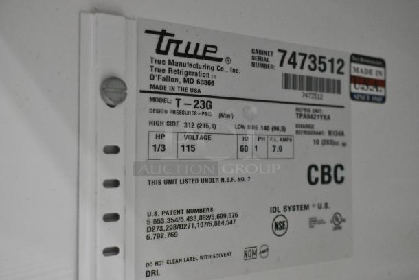 True T-23G Stainless Steel Commercial Single Door Reach In Cooler Merchandiser w/ Poly Coated Racks on Commercial Casters. 115 Volts, 1 Phase. Tested and Working! - Image 3 of 5