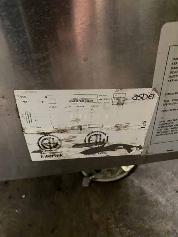 Asber Commercial Stainless Steel Natural Gas Powered 6 Burner Range! With Full Sized Oven Underneath! With Back Splash & Overhead Salamander Shelf! With Oven Rack! On Casters! - Image 8 of 9