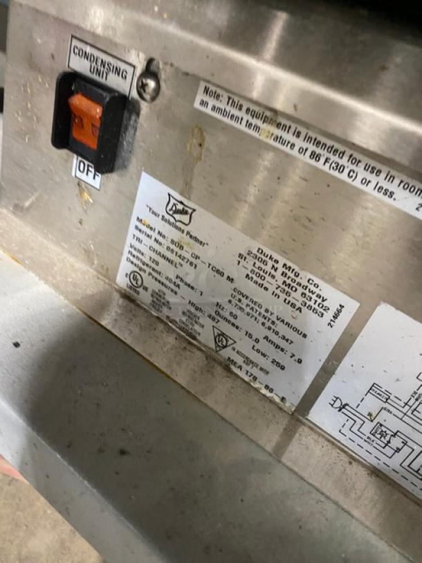 Duke Commercial Subway Style Sandwich Condiment Prep Table! With Tri-Channel Cold Pan! With Angled Glass Sneeze Guard! With Stainless Steel Functionality Shelfing! With Additional Dry Storage Underneath! On Casters! 120V 1 Phase! Model: SUB-CP-TC60 M SN: 06142761! - Image 7 of 8