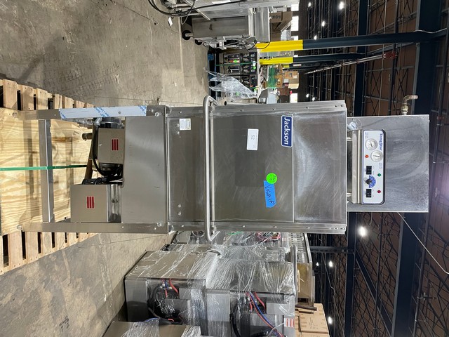 Pass-through dishwasher with integrated booster heater system