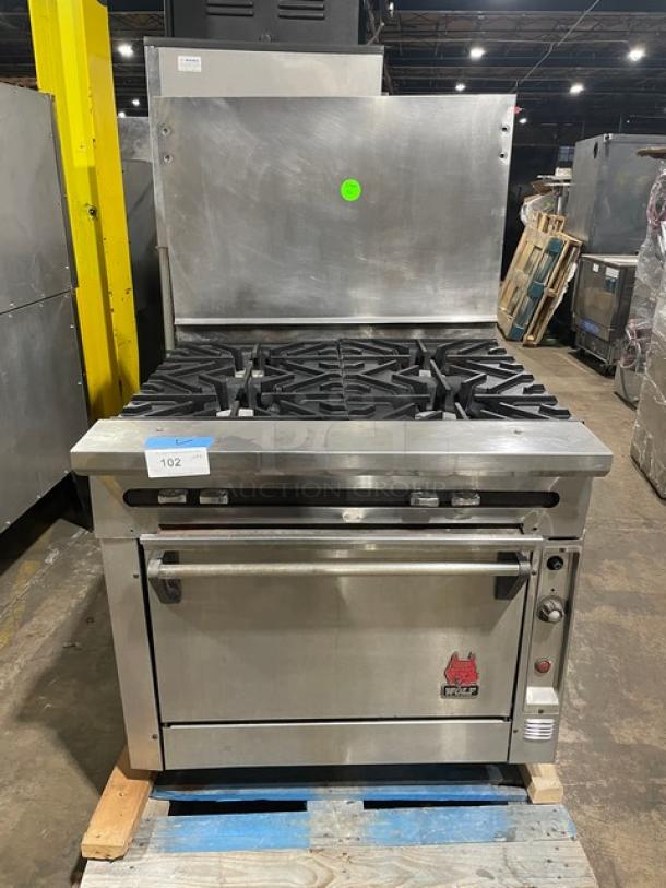 Great! Wolf Commercial Stainless Steel Natural Gas Powered Wide Body 4 Burner Range! With Full Size Oven Underneath! With Back Splash! With Wire Oven Racks! On Casters! Working When Removed! - Image 1 of 9