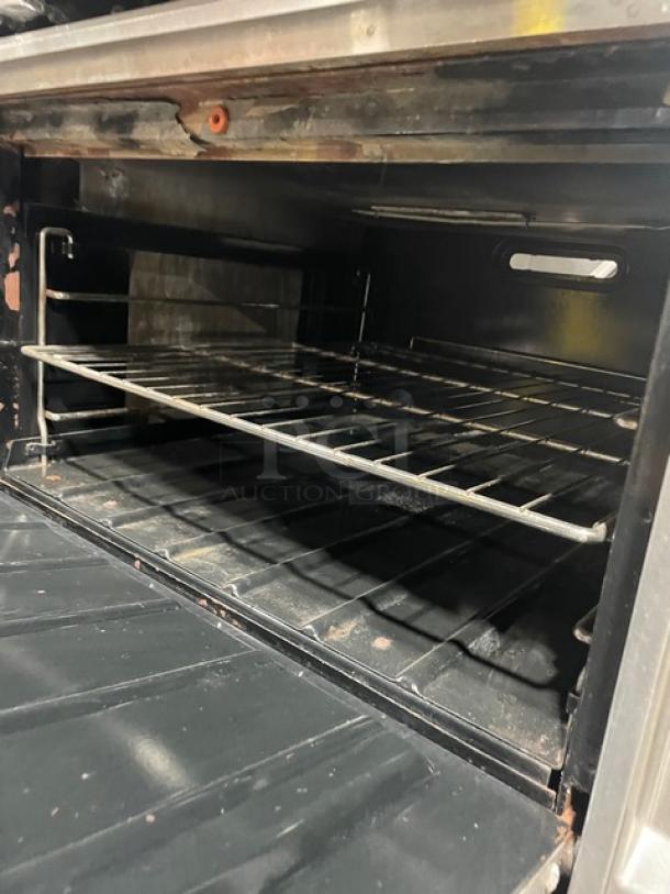 Great! Wolf Commercial Stainless Steel Natural Gas Powered Wide Body 4 Burner Range! With Full Size Oven Underneath! With Back Splash! With Wire Oven Racks! On Casters! Working When Removed! - Image 7 of 9