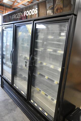 2018 True GDM-72F-HC Metal Commercial 3 Door Reach In Freezer Merchandiser w/ Poly Coated Racks. 208-230 Volts, 1 Phase. Tested and Working!