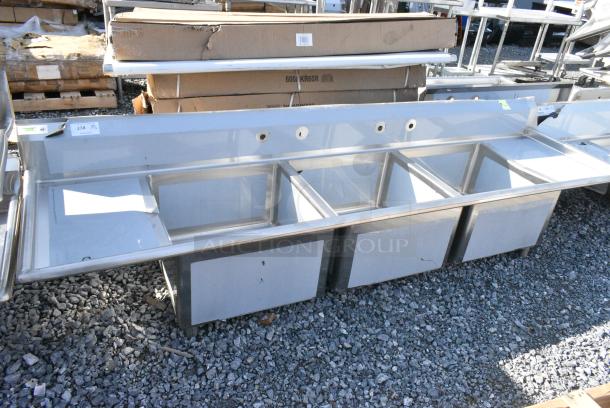 BRAND NEW SCRATCH AND DENT! Regency 600S32424218 Stainless Steel Commercial 3 Bay Sink w/ Dual Drain Boards. No Legs. Bays 24x24x14. Drain Boards 16x25 - Image 1 of 5