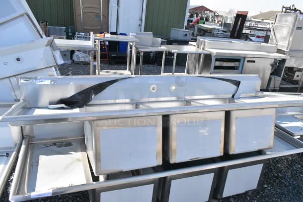 BRAND NEW SCRATCH AND DENT! Regency 600S31824218 Stainless Steel Commercial 3 Bay Sink w/ Dual Drain Boards. No Legs. Bays 18x24x14. Drain Boards 16x25 - Image 1 of 5