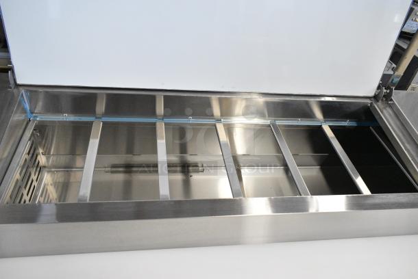 BRAND NEW SCRATCH AND DENT! 2024 Avantco 178APPT91HC Stainless Steel Commercial Pizza Prep Table on Commercial Casters. 115 Volts, 1 Phase. Tested and Working! - Image 4 of 9