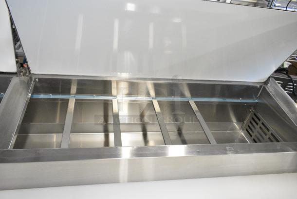 BRAND NEW SCRATCH AND DENT! 2024 Avantco 178APPT91HC Stainless Steel Commercial Pizza Prep Table on Commercial Casters. 115 Volts, 1 Phase. Tested and Working! - Image 5 of 9