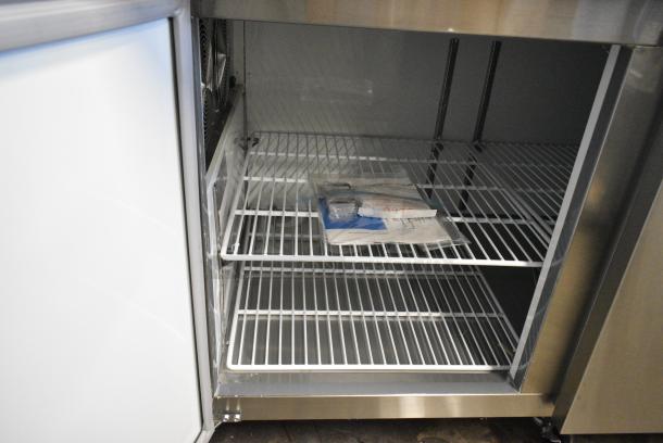 BRAND NEW SCRATCH AND DENT! 2024 Avantco 178APPT91HC Stainless Steel Commercial Pizza Prep Table on Commercial Casters. 115 Volts, 1 Phase. Tested and Working! - Image 6 of 9