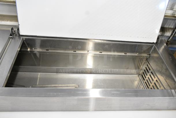 BRAND NEW SCRATCH AND DENT! 2023 Avantco 178APPT71HC Stainless Steel Commercial Pizza Prep Table on Commercial Casters. 115 Volts, 1 Phase. Tested and Working! - Image 3 of 8