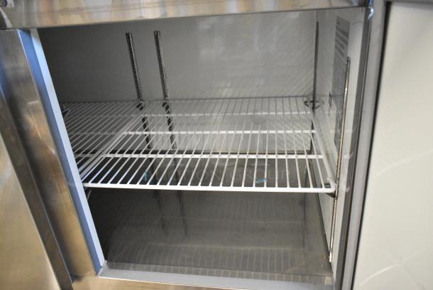 BRAND NEW SCRATCH AND DENT! 2023 Avantco 178APPT71HC Stainless Steel Commercial Pizza Prep Table on Commercial Casters. 115 Volts, 1 Phase. Tested and Working! - Image 6 of 8